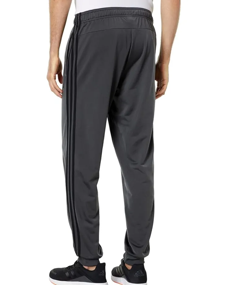 essentials_stripes_tricot_1-1.webp adidas Activewear | Pants<Essentials 3-Stripes Tricot Jogger Pants Black/Black 1